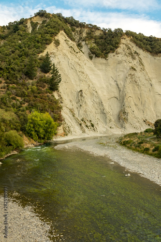View of Rangitikei River and the surrounding cliffs as the river weaves through the lush countryside