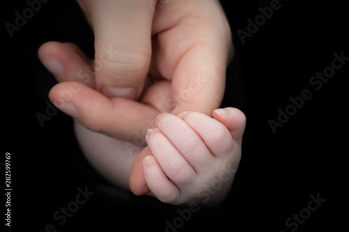 Baby Hand holding Mother's Finger