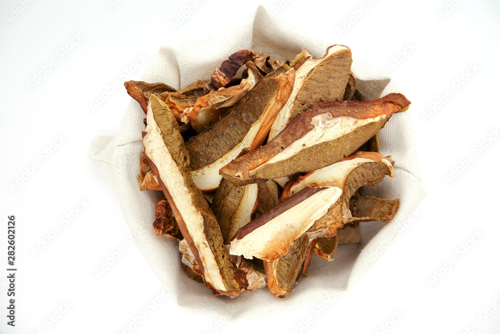 Dried white mushrooms on a white background. Dried porcini mushrooms. Isolated on white background.