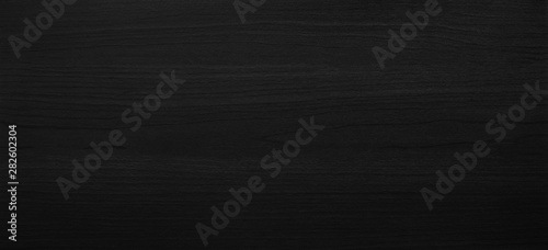 Black wooden texture background with abstract pattern surface. Dark wood plank furniture made from hardwood material and desk or table structure wallpaper.
