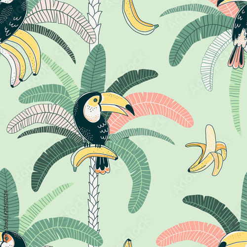 Toucan vector color seamless pattern. Jungle flora and fauna background. Fruit eating bird. Rainforest palm and banana. Exotic bird. Decorative tropical textile, wallpaper, wrapping paper design
