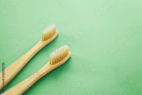 Two wooden toothbrushes with neo mint color