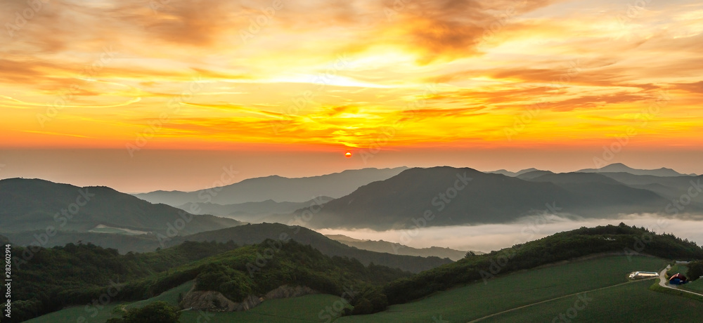 A landscape view of beautiful sunrise and sea of clouds at Anbandeogi of Gangneung in the Alpine cabbage field, South Korea.