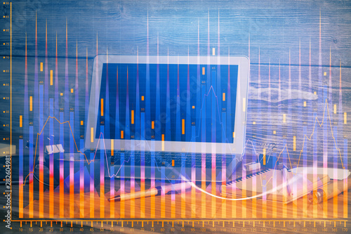 Multi exposure of forex graph and work space with computer. Concept of international online trading. © peshkova