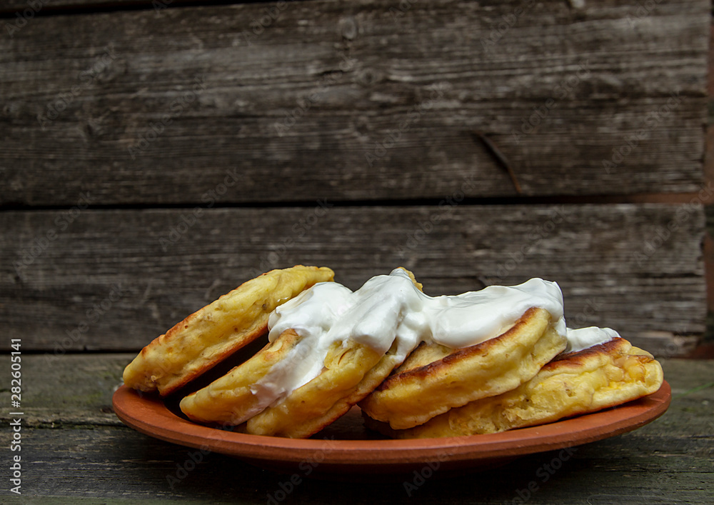 homemade corn pancakes with sour cream, nuts and figs homemade corn pancakes with sour cream, nuts and figs