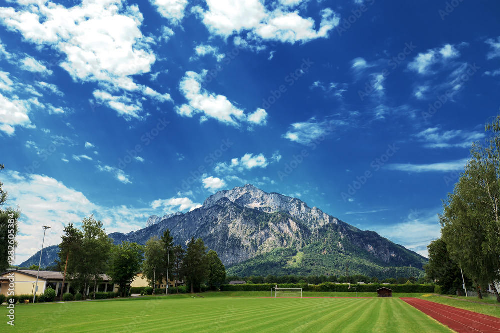 Summer landscape on sports fields and alps mountains, Austria Summer landscape on sports fields and alps mountains, Austria