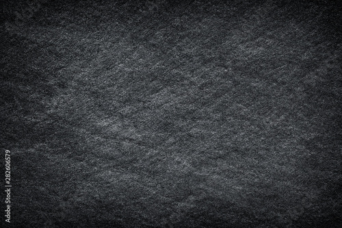 Dark grey black slate abstract background or texture.