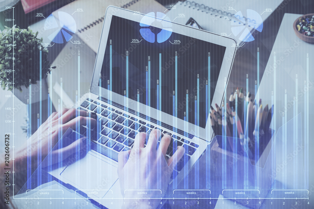 Forex graph with businessman typing on computer in office on background. Concept of analysis. Double exposure. Forex graph with businessman typing on computer in office on background. Concept of analysis. Double exposure.