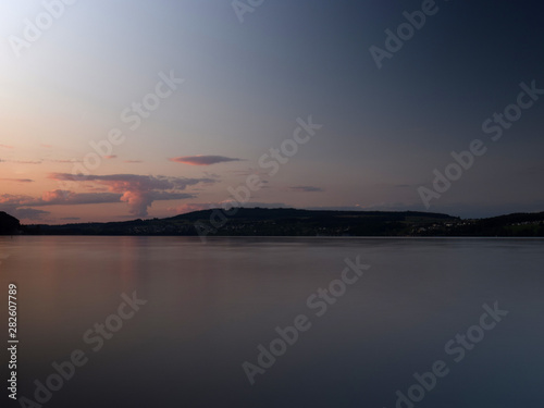 view of the lake after sunset  moonrise  beautiful colors