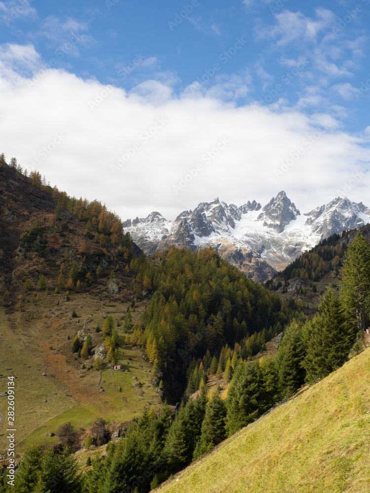 Approach to the Sustenpass, Switzerland with autumn colors and snowy peaks