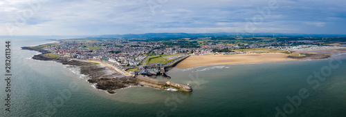 Aerial view of Porthcawl beach harbour and fun fair in South Wales UK photo