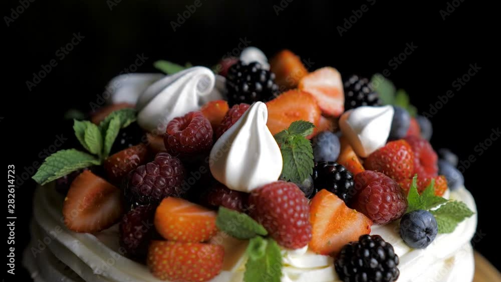 Dessert Anna Pavlova on a black background Dessert Anna Pavlova on a black background