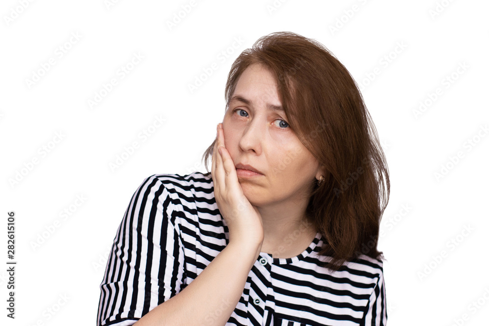 An aged woman holds her cheek - toothache, sadness, discomfort, problems. An aged woman holds her cheek - toothache, sadness, discomfort, problems.