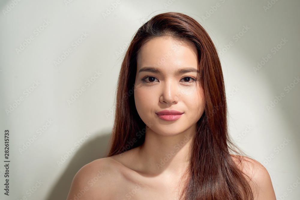 Fototapeta premium Beauty sunshine girl portrait. Pretty happy woman enjoying summer outdoors in bright Sunny day