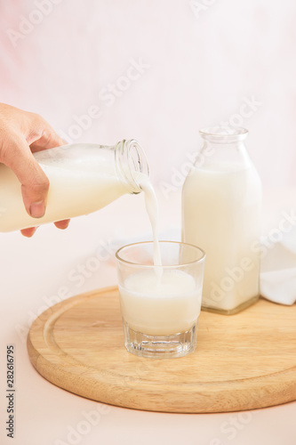 fresh milk in glasses with sugar cubes