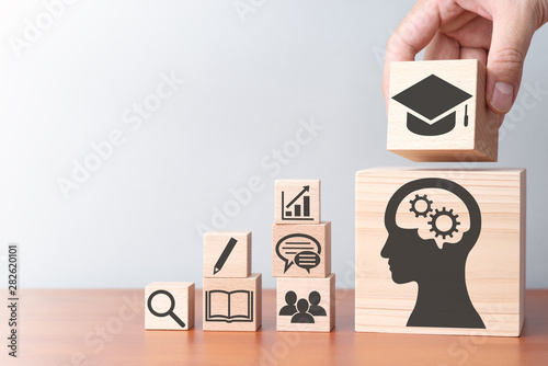 Education and stock of knowledge. Building wood blocks on table. photo