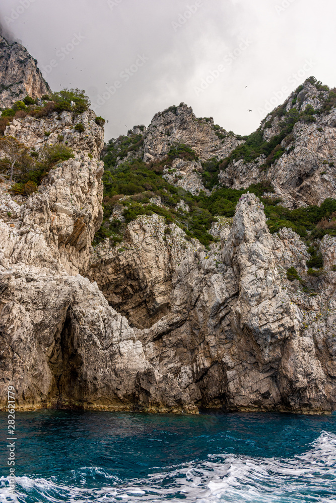 Italy, Capri, view of the coast seen from the sea.