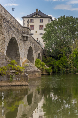 Old stone bridge over the Lahn river in Limburg, Germany