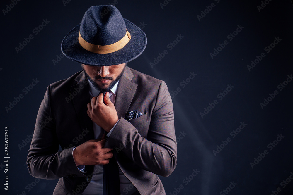 Arabic handsome businessman with cool hairstyle posing in a suit in the studio on a white background Arabic handsome businessman with cool hairstyle posing in a suit in the studio on a white background
