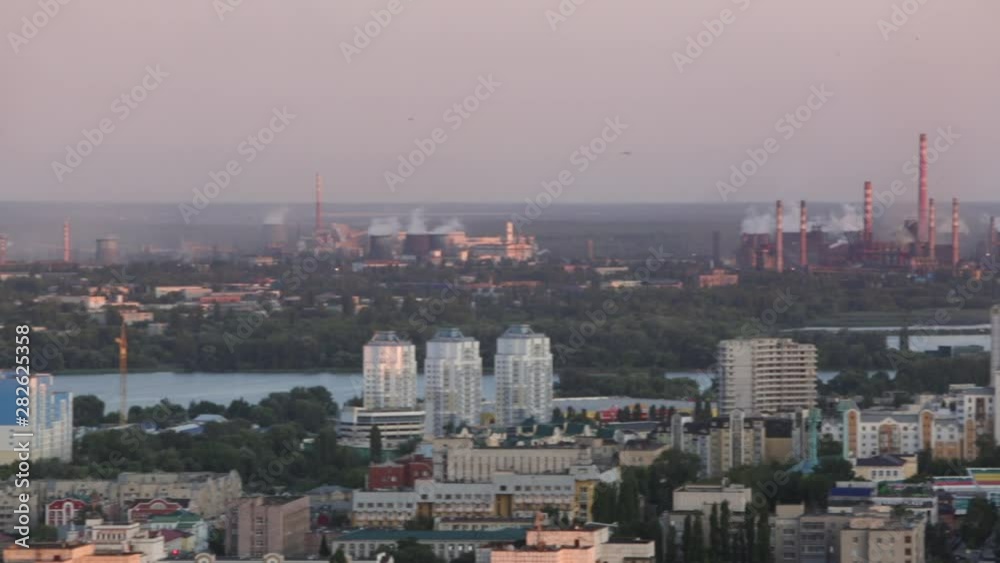 Large factory near the city. Smoke from the pipes. environmental pollution. Pollution of the atmosphere and environment. Bad ecology and health problems in the population Large factory near the city. Smoke from the pipes. environmental pollution. Pollution of the atmosphere and environment. Bad ecology and health problems in the population