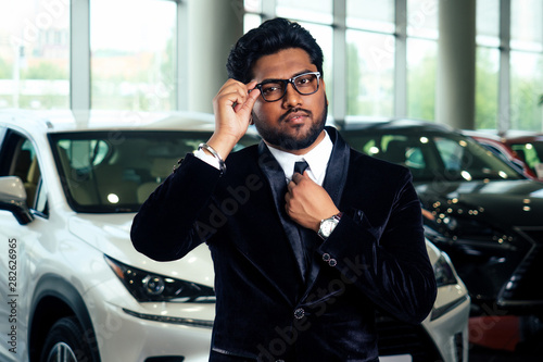 Rich indian businessman in formal wear drive car © yurakrasil