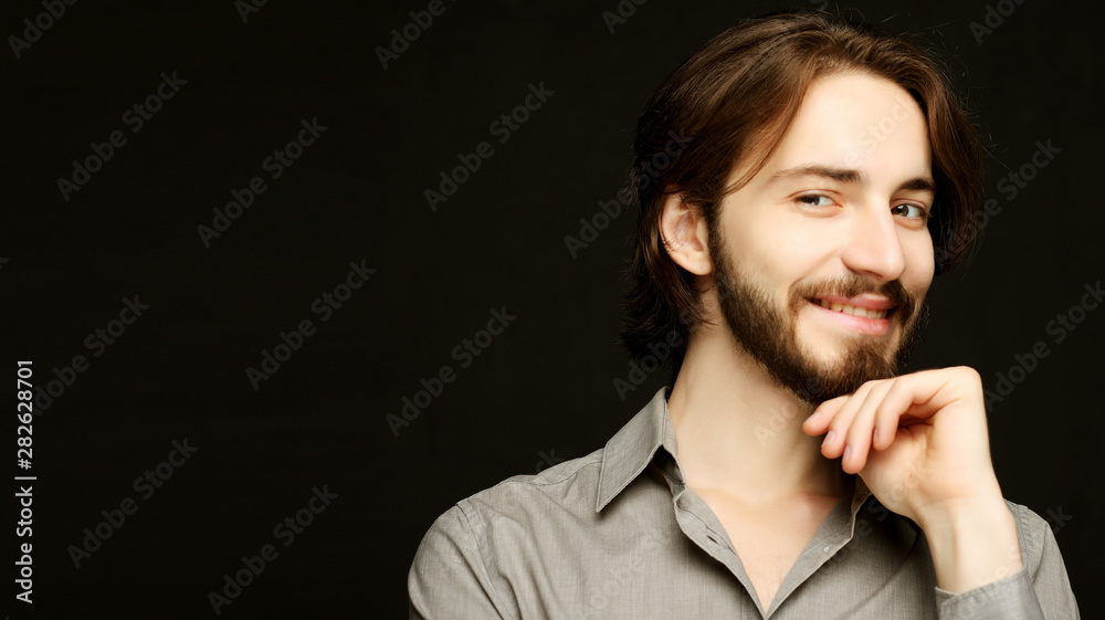 lifestyle and people concept:young man has excited expression, dresssed casually