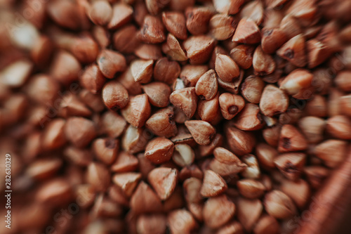 Macro close-up photo of buckwheat groats. Texture background grain buckwheat groats. Image food product porridge buckwheat