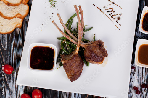 juicy and appetizing steak tamogavok of horse meat on the table, for design in cooking	 photo