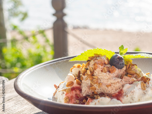 whipped cream with berry and oatmeal, delicious dessert photo