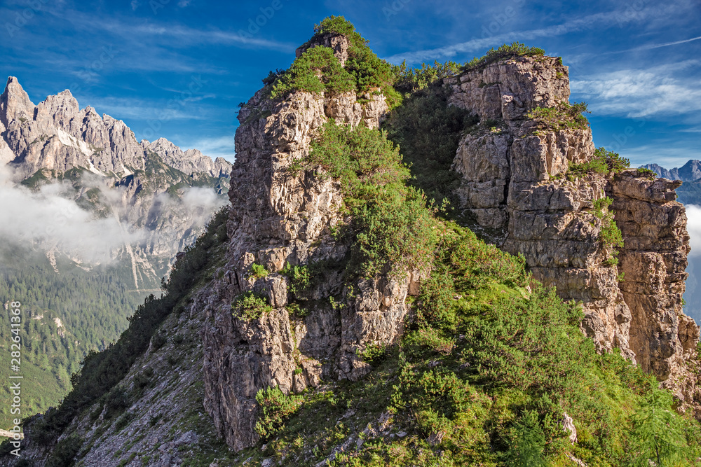 Fototapeta premium Panoramic view of towers and peaks of the Friuli Dolomites, in the morning light, in Friuli, Italy.