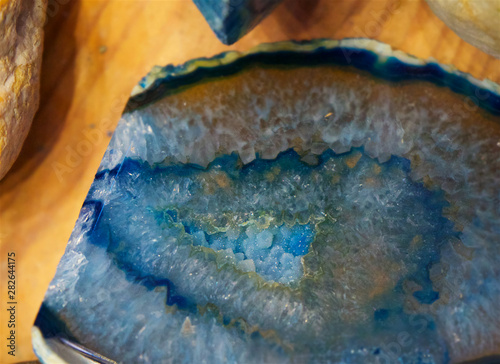 Blue crystal incision on the wooden desk