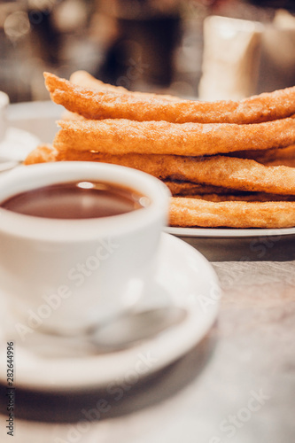 In Spaniards, it is customary to dip churros in a cup with hot chocolate or to serve a dish with churros to serve coffee with milk