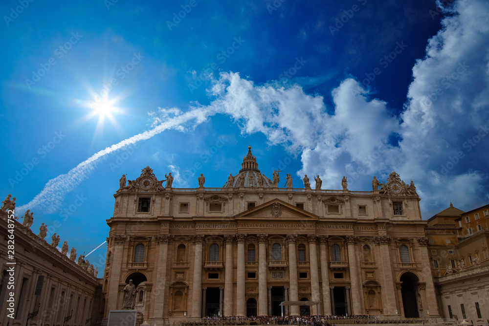 St. Peter's Basilica during the day with a beautiful blue sky in the Vatican