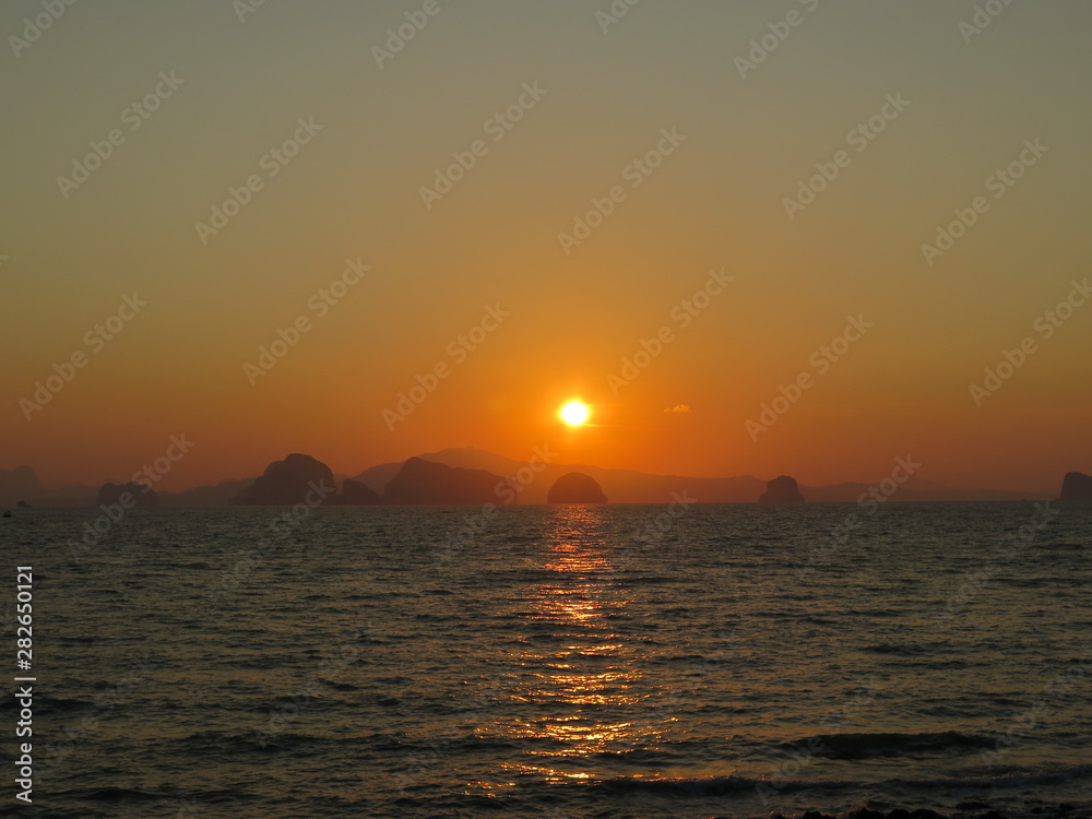 Orange sunset at Klong Jak Beach, Thailand