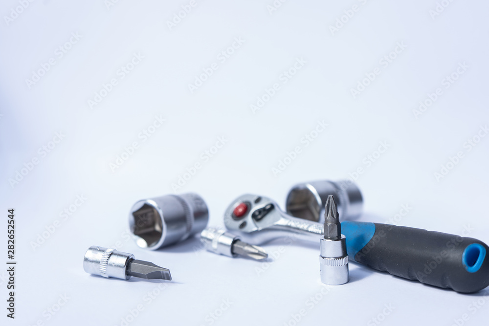 adjustable wrench and nuts on the white backround adjustable wrench and nuts on the white backround