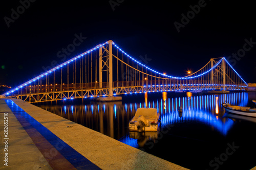 Colorful Bridge at Night with Reflection