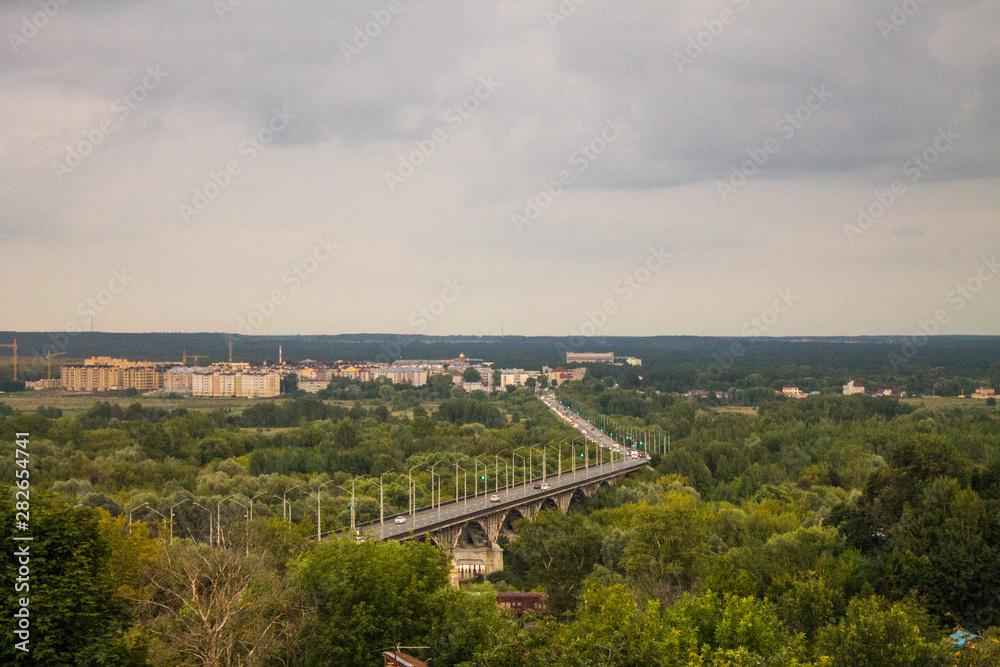 Panorama of the valley with a car bridge over the river Klyazma summer day in Vladimir Russia