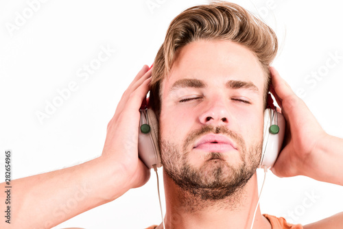 Music fan concept. It is great time to be creating new realities. Man handsome bearded guy listening music headphones white background. Audiovisual spectacular. Melody put over various types of music