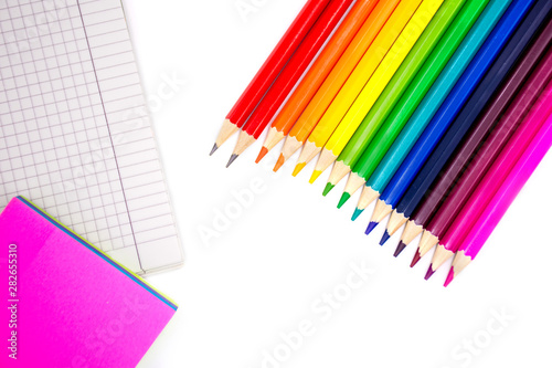 Color pencils  sticky memo and notebook on a white background. Back to school