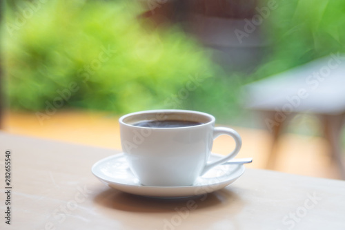 Hot Coffee cup on the wooden table as beverage background