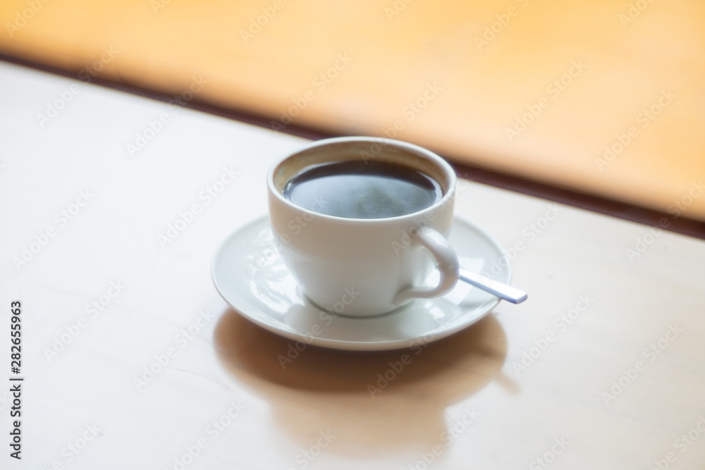 Hot Coffee cup on the wooden table as beverage background Hot Coffee cup on the wooden table as beverage background