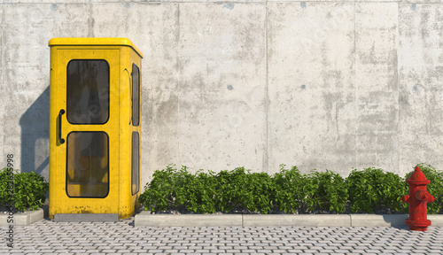 Single old yellow phone booth in retro style on the footpath in the urban exterior opposite the facade of the concrete wall and red fire hydrant. 3D render. photo