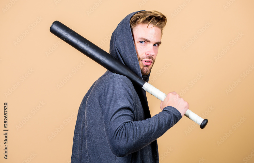 Guy with baseball bat. Dangerous man with serious emotion. Self