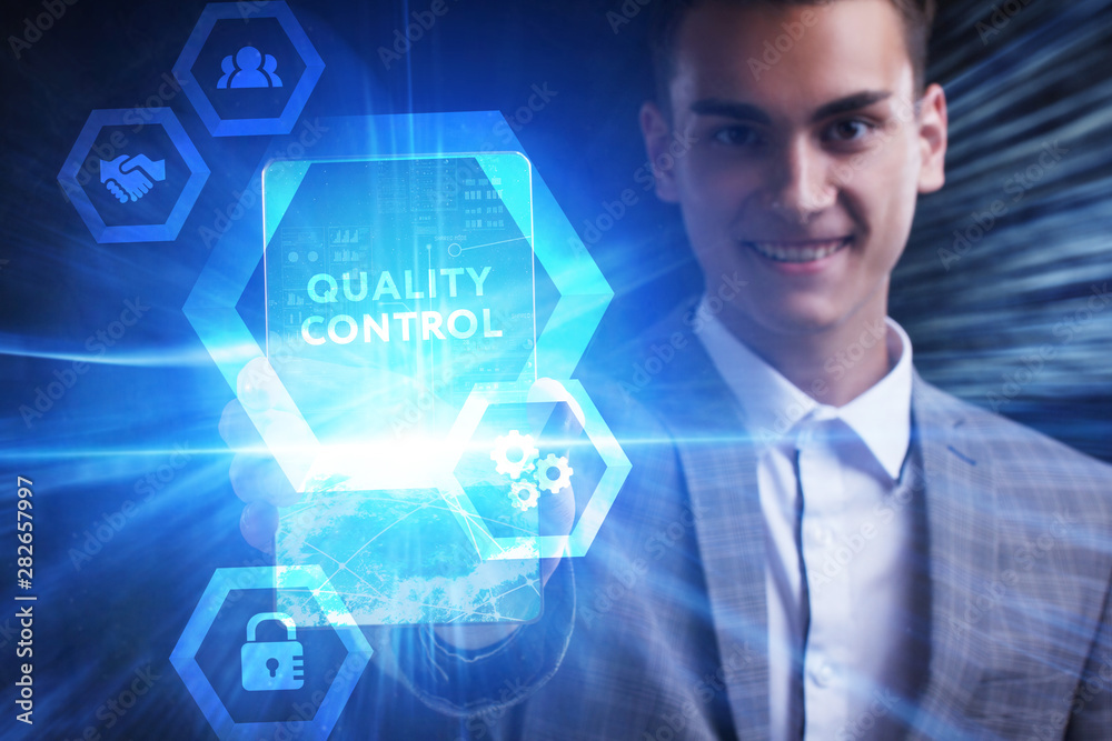 The concept of business, technology, the Internet and the network. A young entrepreneur working on a virtual screen of the future and sees the inscription: Quality control The concept of business, technology, the Internet and the network. A young entrepreneur working on a virtual screen of the future and sees the inscription: Quality control