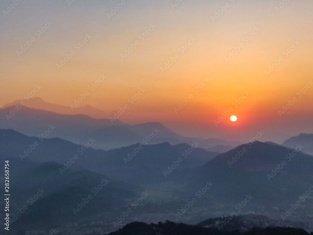 Sun rising over the hills in Pokhara, Nepal