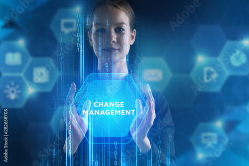 The concept of business, technology, the Internet and the network. A young entrepreneur working on a virtual screen of the future and sees the inscription: Change management