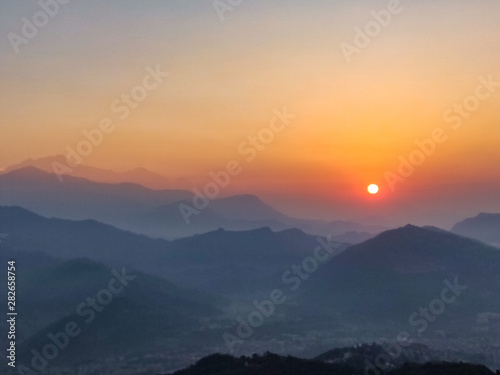 Sun rising over the hills in Pokhara, Nepal © asiraj