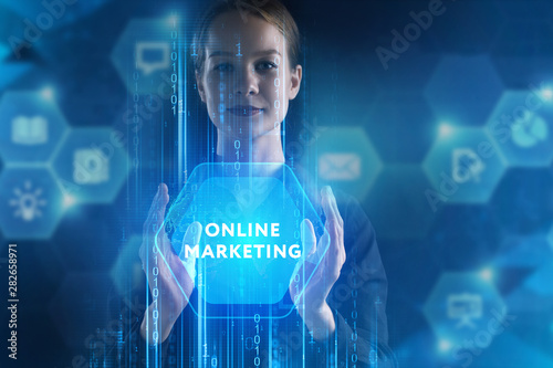 The concept of business, technology, the Internet and the network. A young entrepreneur working on a virtual screen of the future and sees the inscription: Online marketing