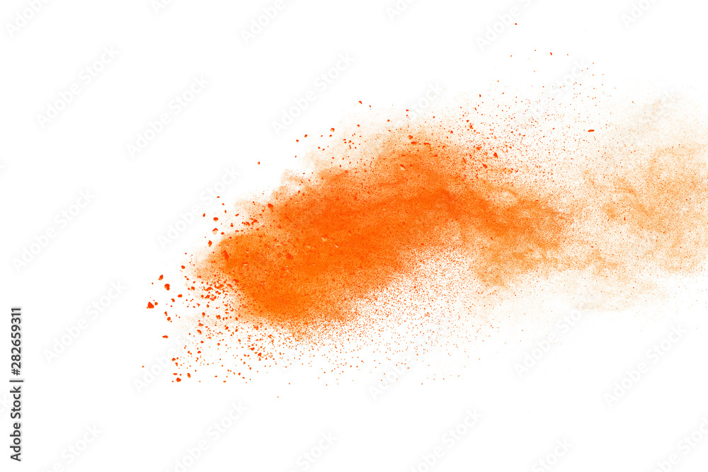 Abstract orange powder explosion. Closeup of orange dust particle splash isolated on white background Abstract orange powder explosion. Closeup of orange dust particle splash isolated on white background
