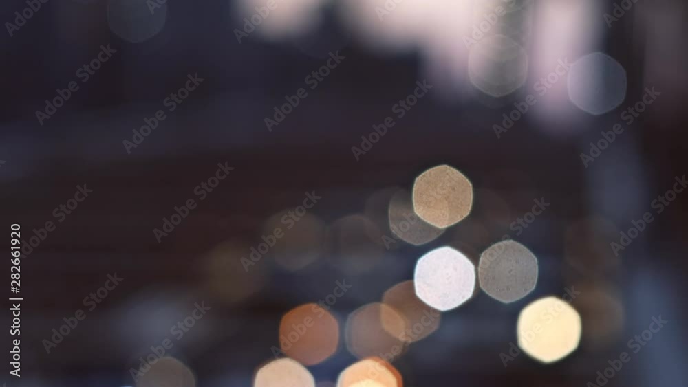 NYC New York City Brooklyn Bridge defocused abstract city night lights background NYC New York City Brooklyn Bridge defocused abstract city night lights background